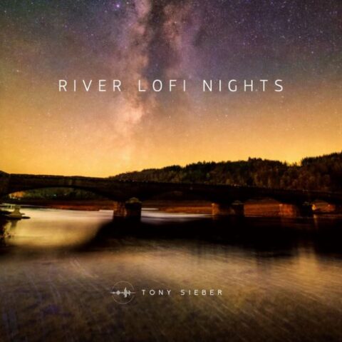 Serene night river landscape with a warm glow, reflecting the immersive and calm atmosphere of Tony Sieber’s music.